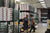Merrill Manufacturing warehouse with employees handling yard hydrant components and packaged inventory.
